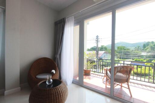 Bright living area with large sliding glass doors leading to a balcony