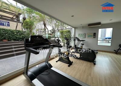 Home gym with exercise equipment and view of the city