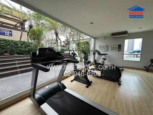 Home gym with exercise equipment and view of the city