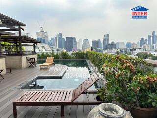 Rooftop terrace with city view and pool