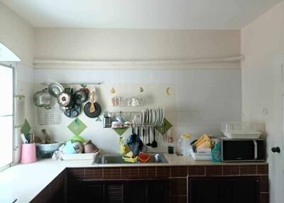Well-organized kitchen with a range of utensils and appliances