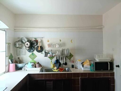 Well-organized kitchen with a range of utensils and appliances