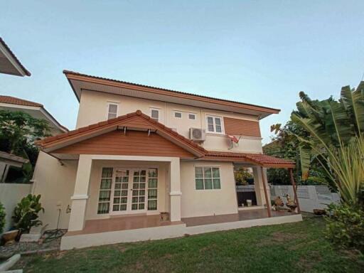 Two-story residential house with garden