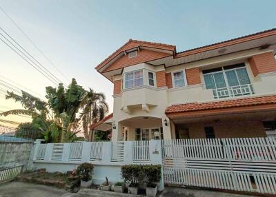 Exterior view of a two-story house with a front yard