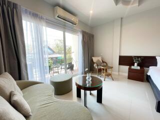 Bright and spacious bedroom with balcony access