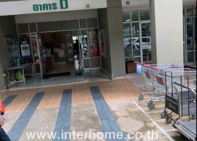 Entrance of a commercial building with shopping carts