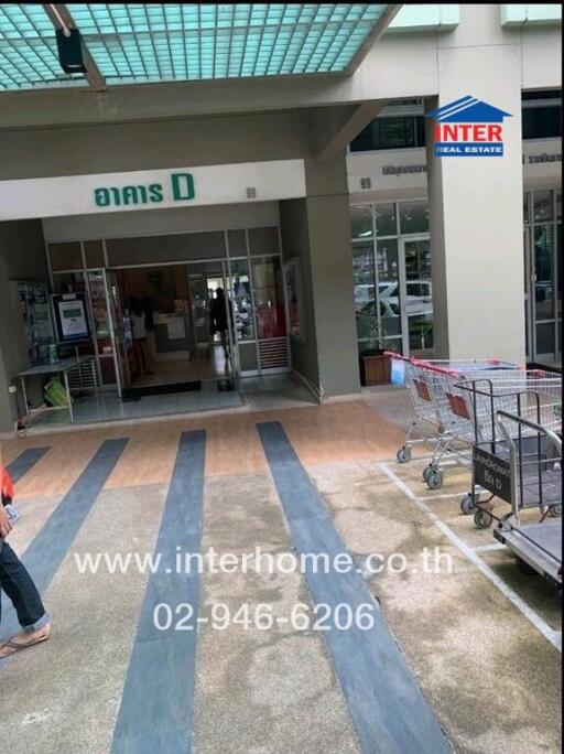 Entrance of a commercial building with shopping carts