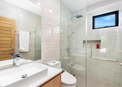 Modern bathroom with glass-enclosed shower