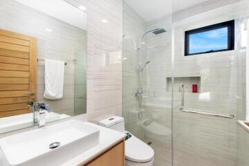 Modern bathroom with glass-enclosed shower