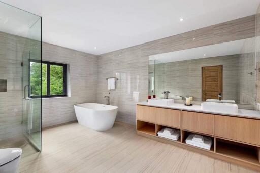 Modern bathroom with freestanding bathtub and large mirror