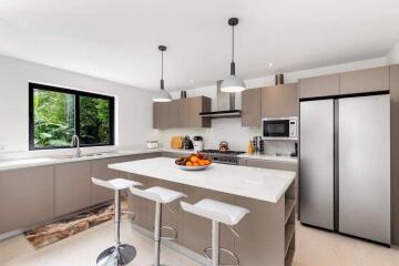 Modern kitchen with island and stainless steel appliances