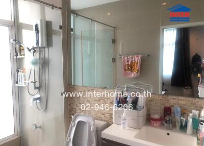 Modern bathroom with glass shower and vanity
