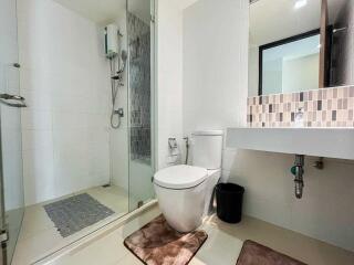 Modern bathroom with shower, toilet, and sink