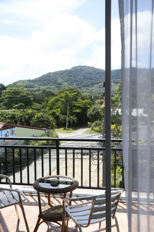 Balcony with outdoor furniture and scenic mountain view