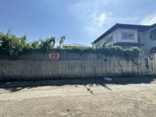 Exterior view with fencing and house under clear sky