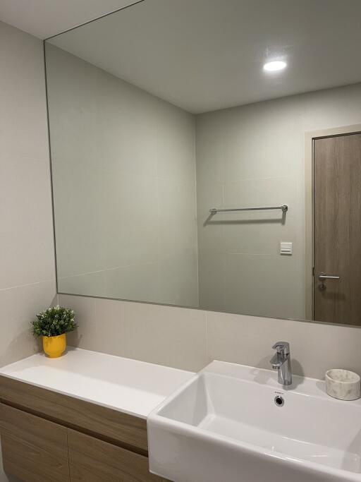 Modern bathroom with large mirror and sink