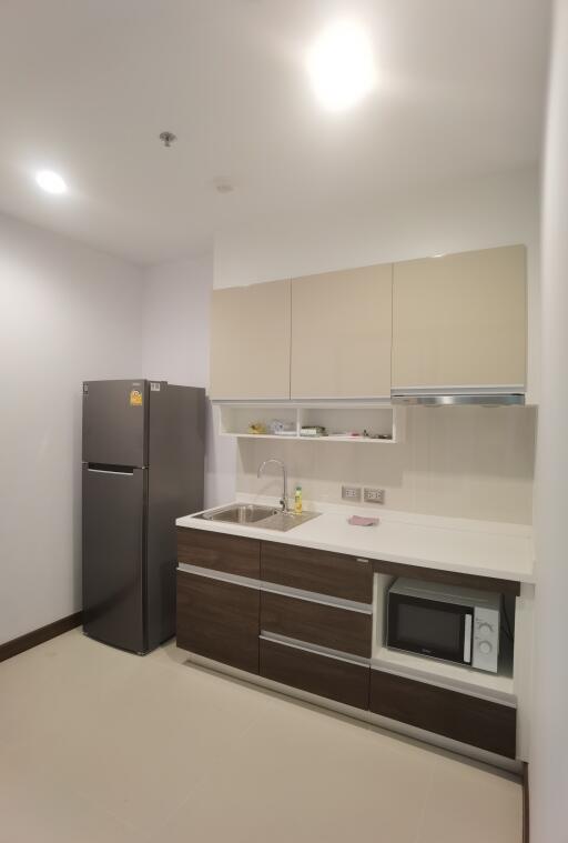 Modern kitchen with cabinets and fridge