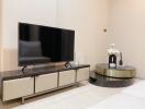 Modern living room with a large television and stylish decor