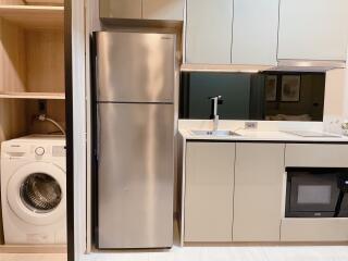 Modern kitchen with appliances and washer