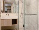 Modern bathroom with glass shower and floating vanity