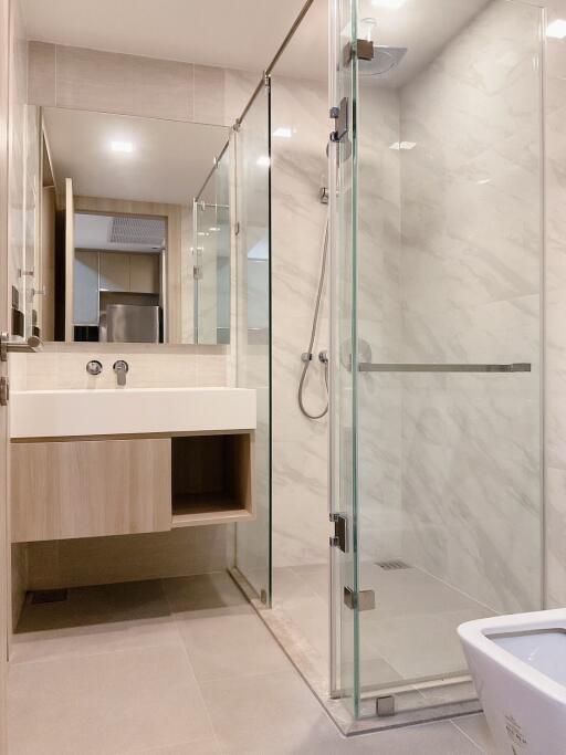Modern bathroom with glass shower and floating vanity