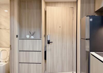 Modern minimalist kitchen view with adjacent bathroom