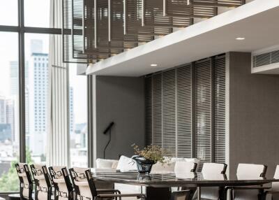 Modern dining area with contemporary lighting and seating arrangement