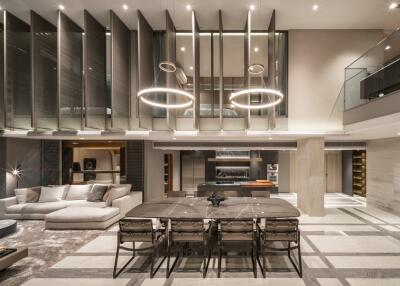 Modern open-concept living and dining area with high ceilings