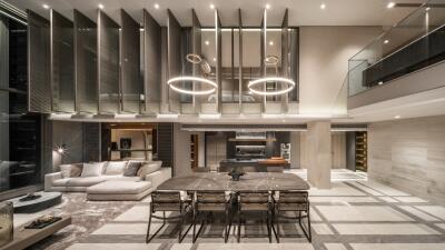 Modern open-concept living and dining area with high ceilings