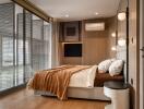 Modern bedroom with large windows and bedside lighting