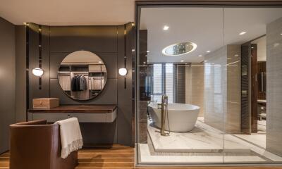 Modern bathroom with a bathtub and dressing area