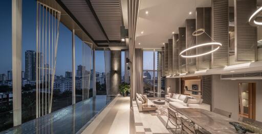 Elegant modern living area with city view, stylish lighting, and an infinity pool