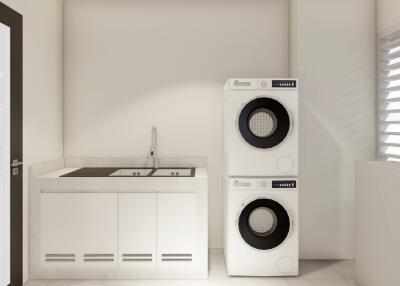 Modern laundry area with stacked washer and dryer