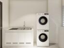 Modern laundry area with stacked washer and dryer