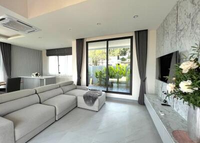 Modern living room with large windows and sectional sofa
