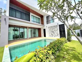 Modern two-story house with pool and garden