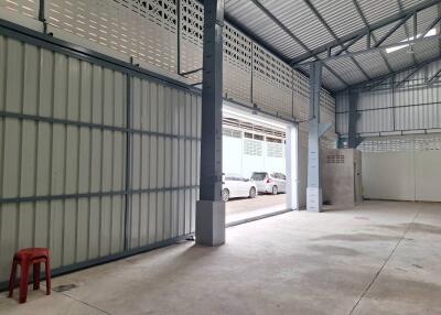 Spacious industrial-style building with roller door access