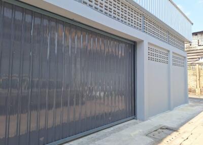 External view of a building with a closed garage door