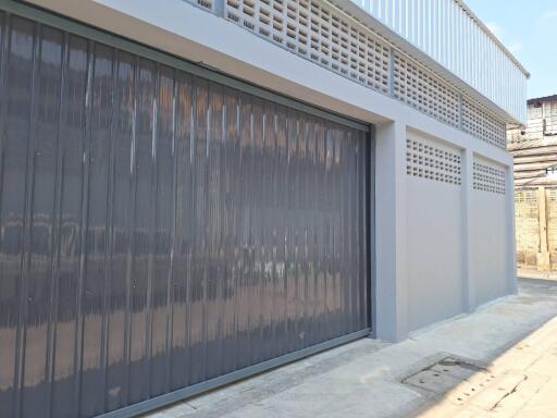 External view of a building with a closed garage door