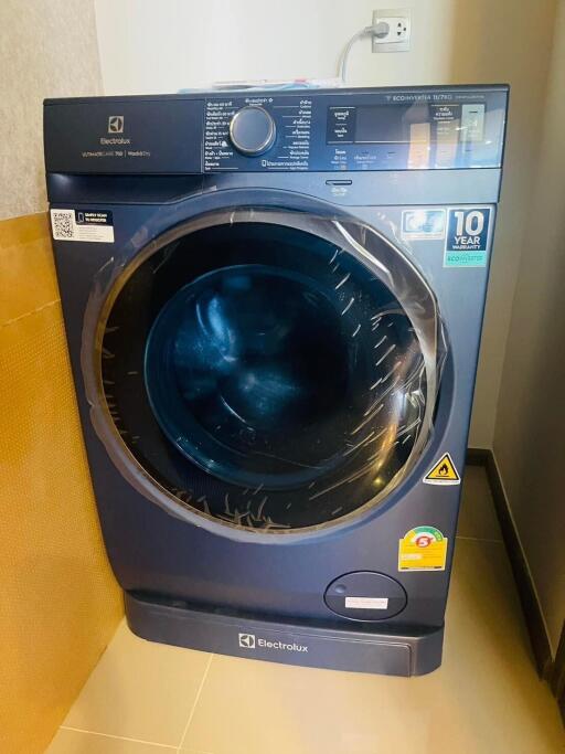 Modern front-loading washing machine in a laundry room