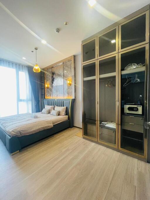 Spacious bedroom with large bed and built-in wardrobe