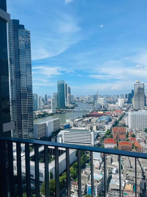 High-rise building balcony with city skyline view