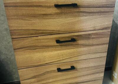 Wooden chest of drawers with four handles