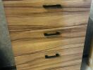 Wooden chest of drawers with four handles