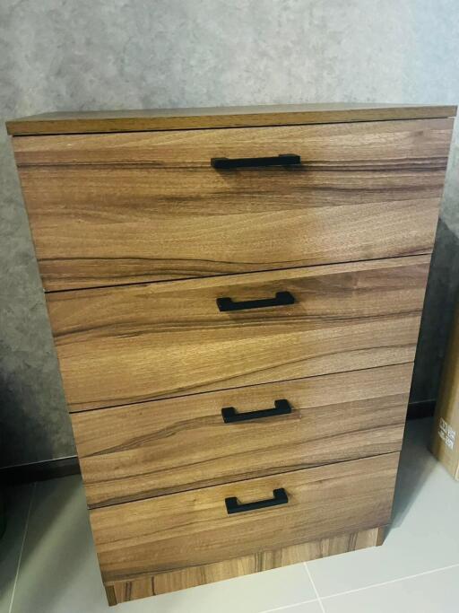 Wooden chest of drawers with four handles