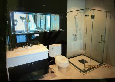 Modern bathroom with glass shower and large mirror