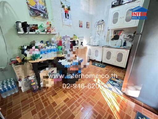 Small kitchen with various items and appliances