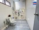 Spacious bathroom with a toilet, shower, and tile flooring