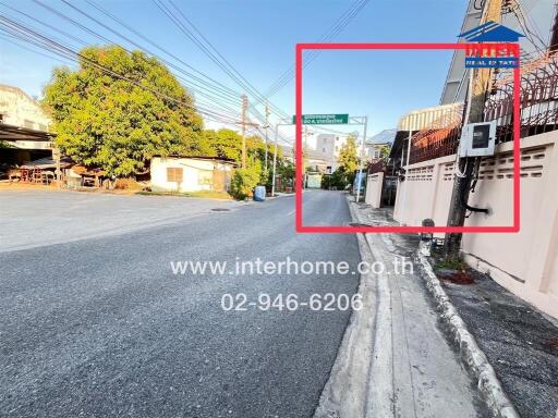 Residential street view with houses and electrical wires