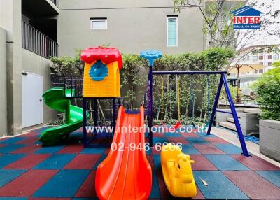 Colorful playground area with slides and swings